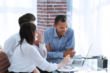 business team discussing new ideas sitting at his Desk