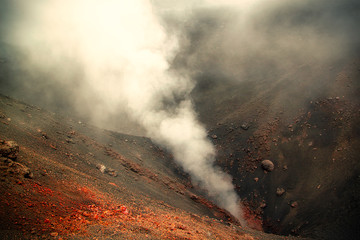 View of a crater on Mount Etna in Sicily, Italy on a cloudy summer day