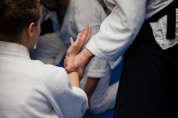 Aikido training. Athletes work out the techniques on each other