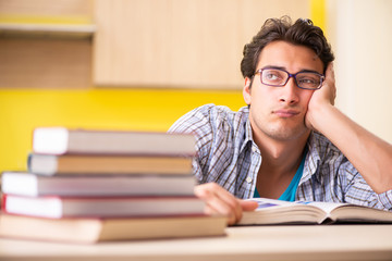 Student preparing for exam sitting at the kitchen 