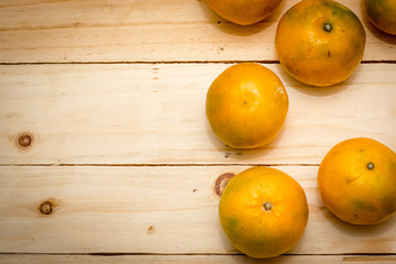 tangerine orange on wood