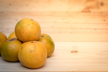 tangerine orange on wood