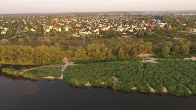 Ukrainian river desna fly away dronie shot on sunset
