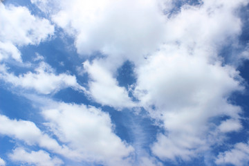 Obraz premium White puffy clouds formation over clear deep blue sky