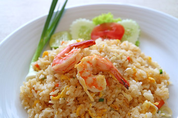 Close-up of Thai style fried rice with shrimp or Khao Pad Goong served on ceramic white plate