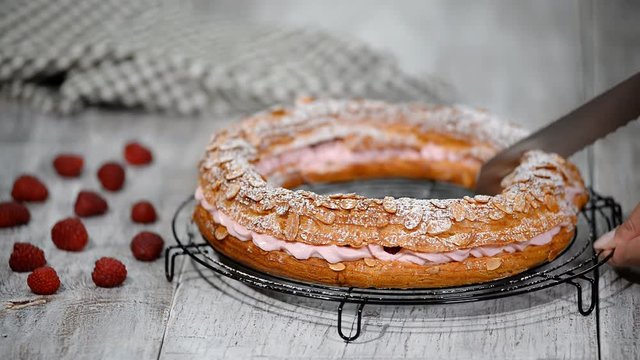 Homemade choux pastry cake Paris Brest with raspberries. French dessert.