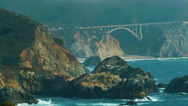 Extreme Telephoto: Cars move across Bixby Creek Bridge, along Big Sur Coastline