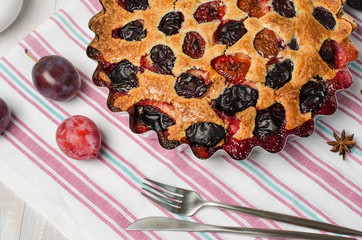 Plum pie on a light background.