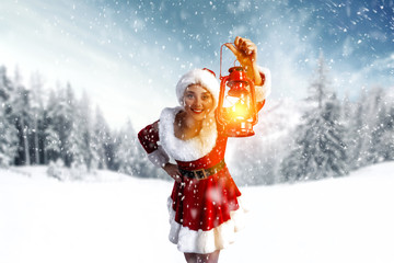 Santa Claus woman and winter landscape with snow. 