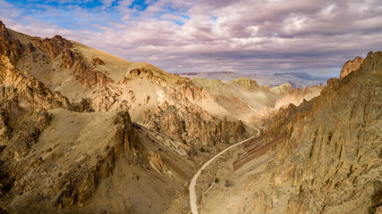 Winding dirt road heads to the Owyhee reservoir in Oregon