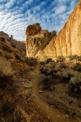Foot path leads through a rocky canyon in a popular hiking place in Oregon