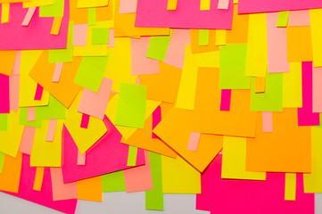 Bright multi-colored stickers on the office white board.