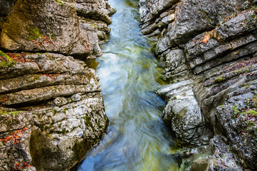 narrow creek and cliffs covered with moss Rettenbachklamm - Bad Ischl Austria