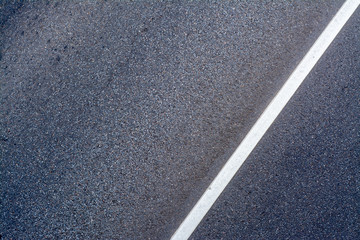 Asphalt road with a dividing strip and a place for the inscription