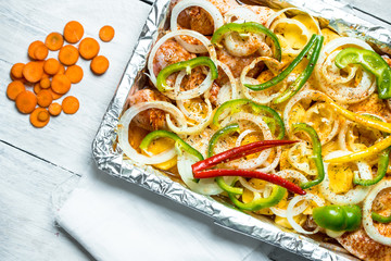casserole of potatoes, peppers, onions and fresh chicken