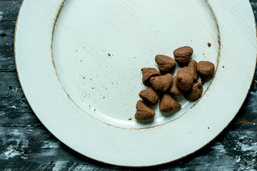 sweet, chocolate truffles and bitter cocoa on a romantic, dark background