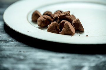 sweet, chocolate truffles and bitter cocoa on a romantic, dark background