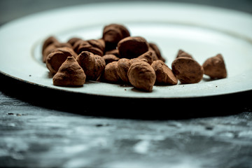 sweet, chocolate truffles and bitter cocoa on a romantic, dark background