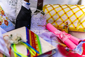 Wedding items, composition of festive paraphernalia for the wedding. Colorful scenery in nature, photo for memory. Represents tenderness and romance of the celebration.