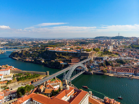 Porto Old Town and Dom Luis Bridge over the Douro river in Porto, Portugal, aerial view.