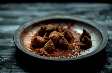 sweet, chocolate truffles and bitter cocoa on a romantic, dark background