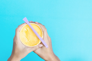 The butter cup is on a blue background.