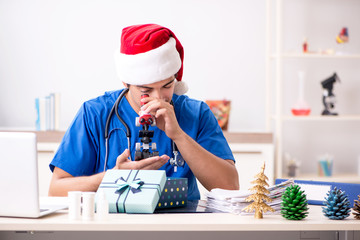 Doctor with gift box in the hospital