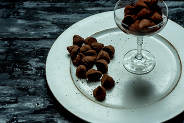 sweet, chocolate truffles and bitter cocoa on a romantic, dark background