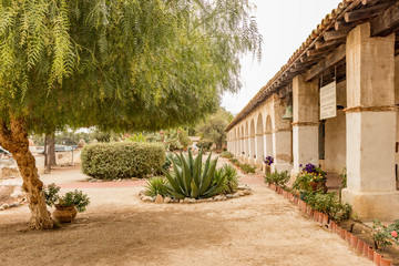 Fototapeta premium Mission San Miguel Arcángel garden, San Miguel, California, USA. One of the series of 21 Spanish religious outposts in Alta California founded by Father Junípero Serra.