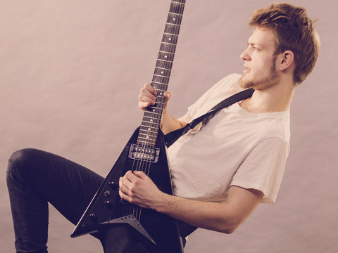 Man playing on electric guitar