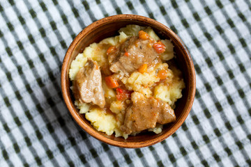 Russian food. Mashed potatoes with gravy and meat. Stewed vegetables.