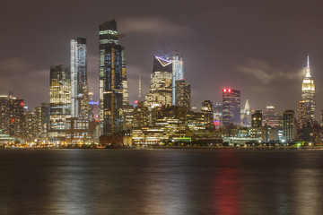 Fototapeta na wymiar Manhattan skyline during rain, clouds sky. 
