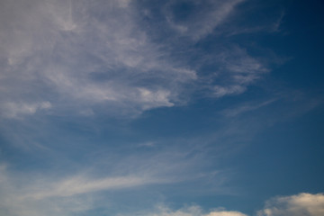 Deep blue sky and white cloud background.	