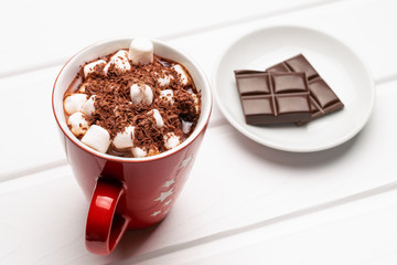 Cocoa and marshmallows in a red mug top view