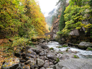 Pré Saint Didier, Aosta, Italy: In the Orrido the river flows in an autumn landscape