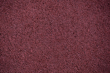 Olympic running track and field texture background. Background of running track field surface closeup macro photo for sport concept.