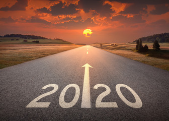 2020 new year at beautiful empty highway at sunset - obrazy, fototapety, plakaty