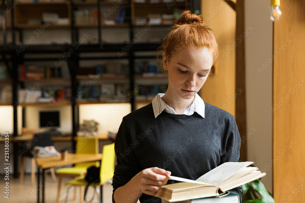 Canvas Prints lovely red haired teenage girl carrying books