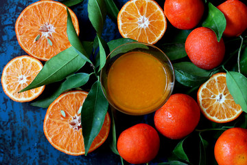 Fresh oranges and tangerines with leaves