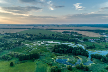 Fototapeta premium Russia, a typical rural settlement. Evening shot from the air