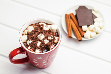 Cocoa in a red mug and ingredients