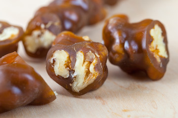 Tasty oriental sweets, churchkhela on the wooden table. Georgian national dessert