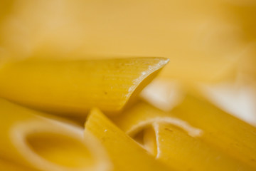 dry pasta, yellow pasta background