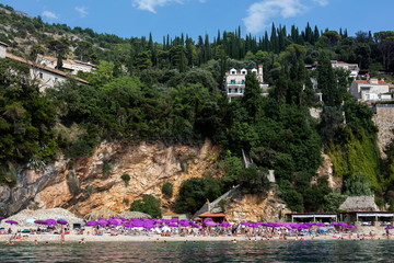 Sveti Jakov Beach, one of the most beautiful beaches in Dubrovnik, located in the in the tiny bay offering a distant look to the Lokrum and the Dubrovnik Old Town.