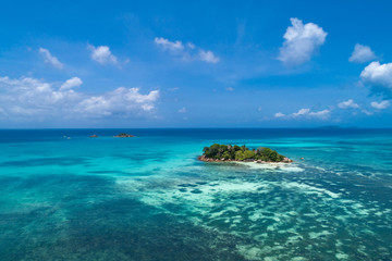 Naklejka premium Aerial view of beautiful island at Seychelles. Top view from drone