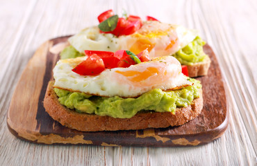 Toasts with avocado and fried egg