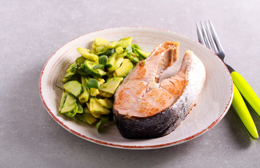 Fried fish steak and salad