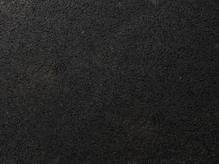 rough black leather from the workshop of the tailor - rough texture of the skin