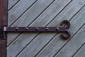 Texture medieval wooden door with metal hinges
