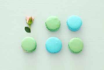 Top view of colorful macaron or macaroon over pastel background. Flat lay.